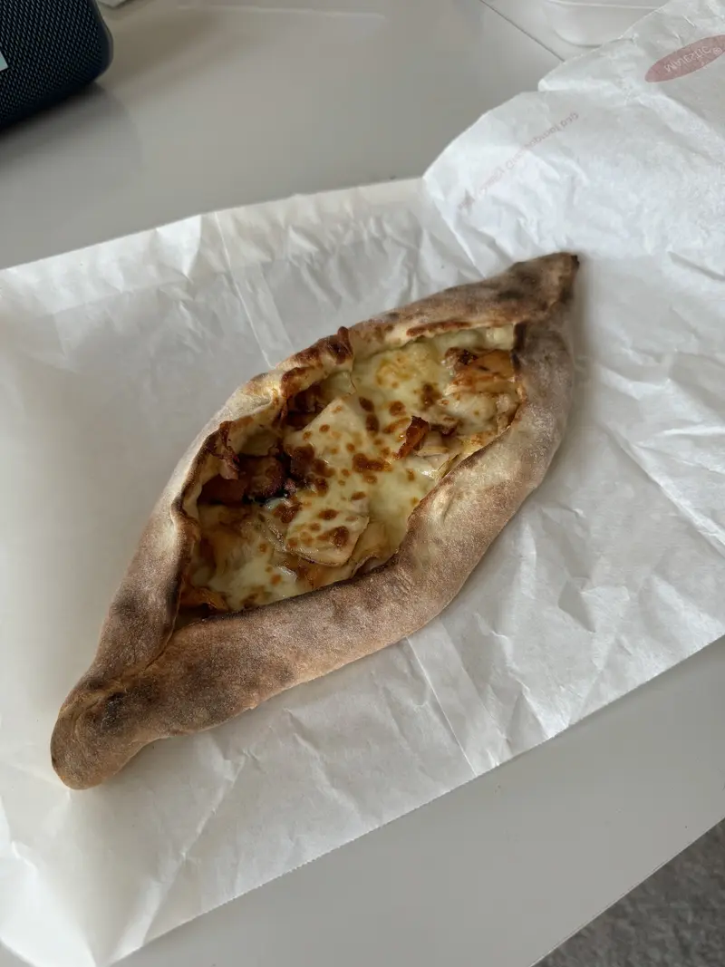 Oven-baked chicken and cheese boat fresh from the oven